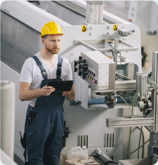 Technician operating industrial equipment